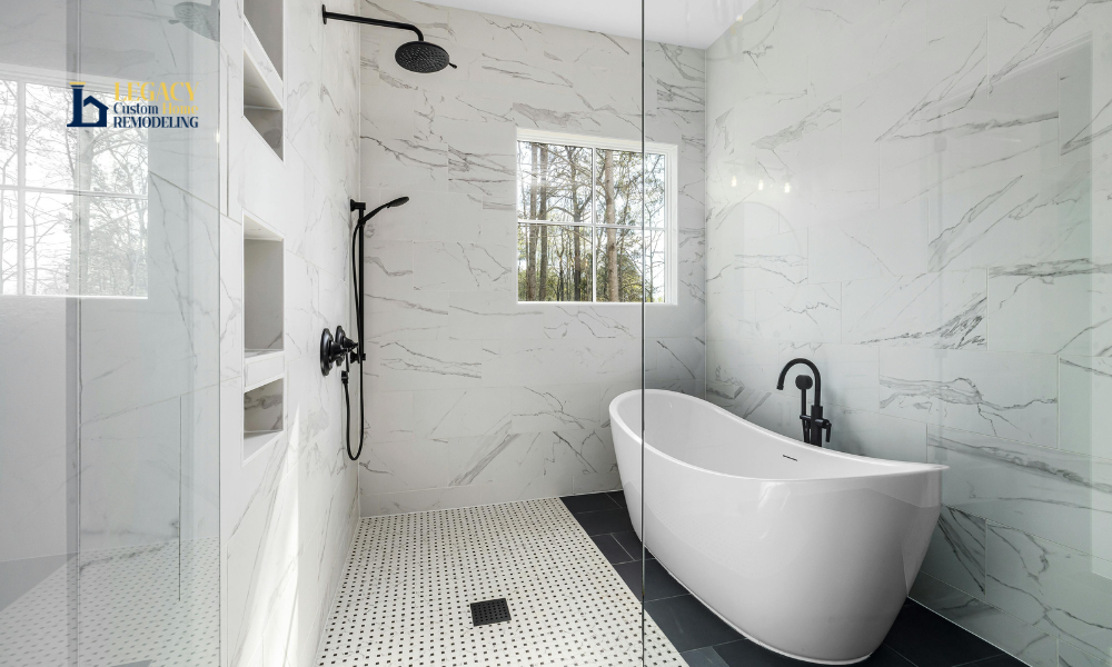 Spacious bathroom with a marble shower featuring a rainfall showerhead, black fixtures, and a freestanding white tub. Large window offers natural light.